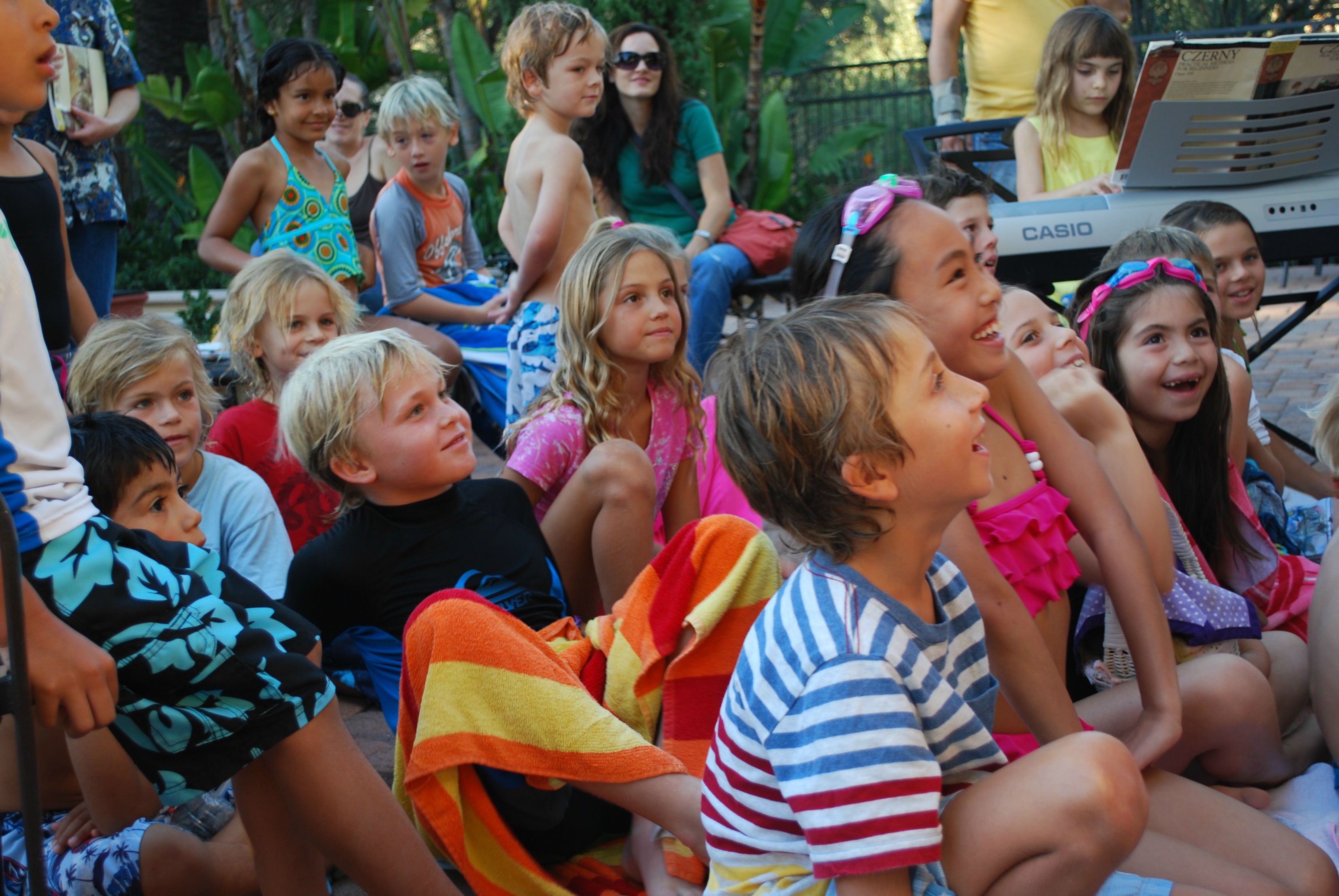 Luna laughing in the puppet show audience.