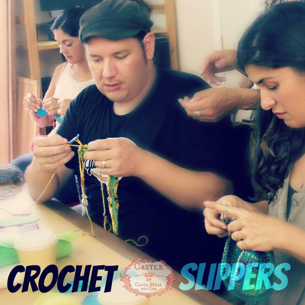 2764 150915 Josh crocheting a pair of slippers for his wife flanked by Yvonne, Christine and Roxanna