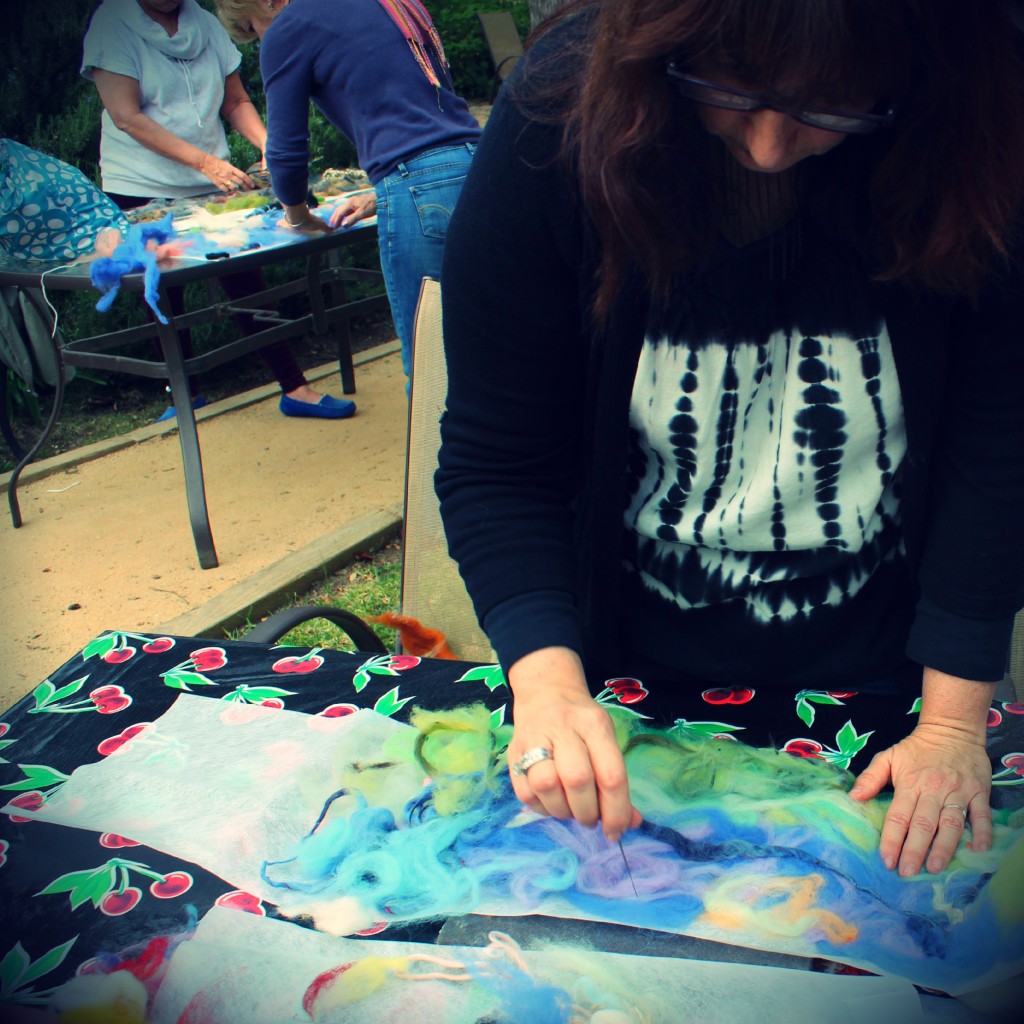 130123 Julie tacking roving designs onto Artfelt paper with barbed needle-felting needle 2