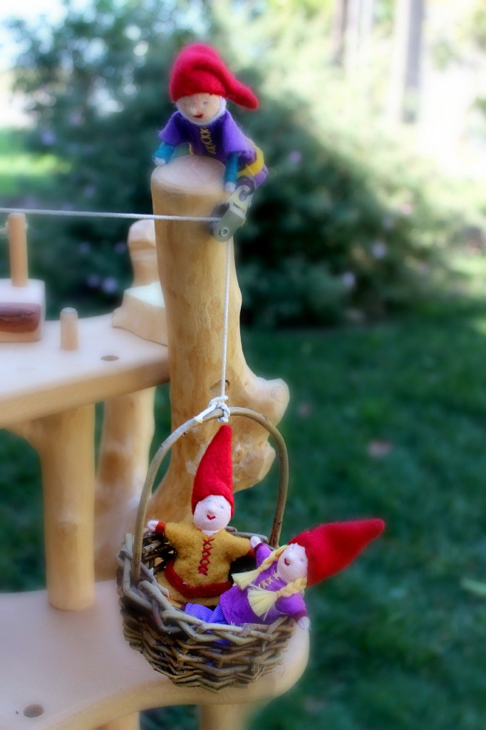 130226 Baskets of gnome children riding a basket on pulley up a magic fairy tree house 2