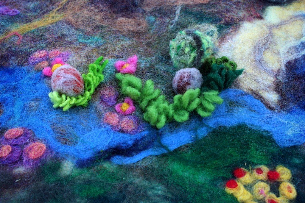 130213 Jzin added yarn as grass and meadow flowers on wet-felted playscape
