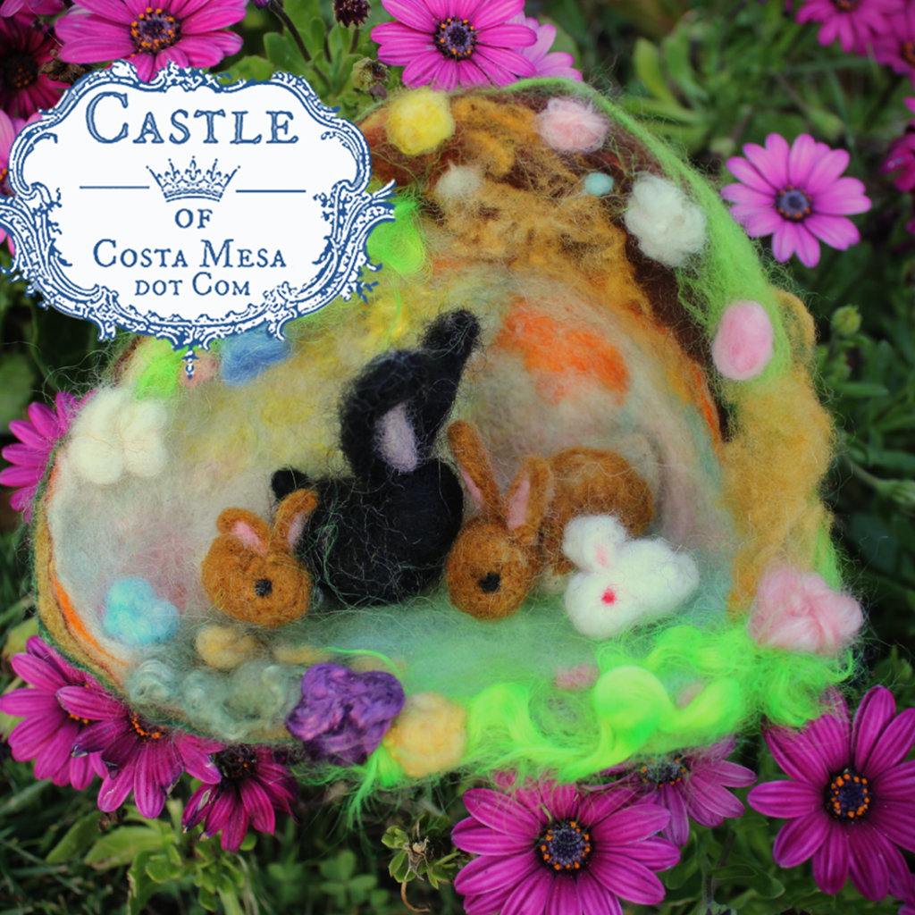 130324 Spring craft. A family of felted rabbits in a burrow. logo