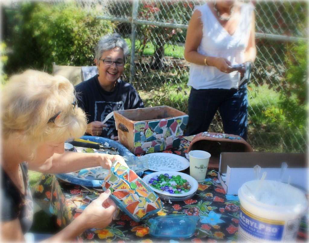 130410 Kim and Gaby adding mosaic pieces to planters using Acrylpro acrylic glue
