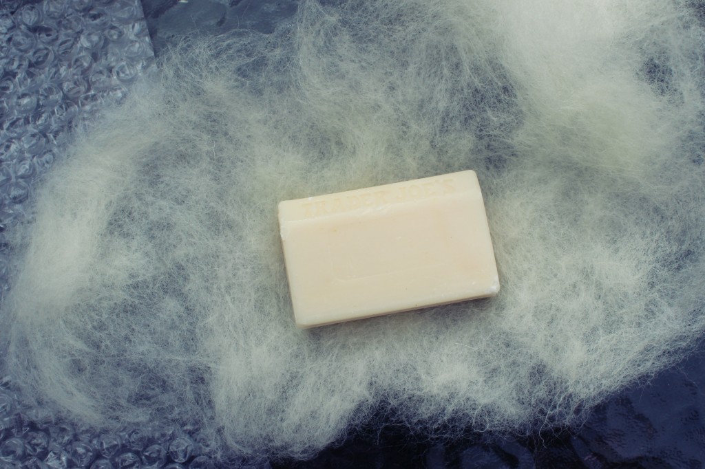 130501 Jzin wet-felting a bar of soap in wool batting