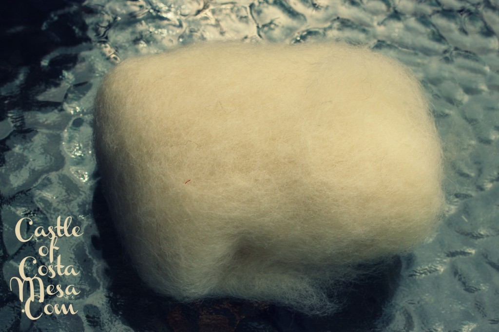 130501 Wrapping bar soap in 2 layers of white wool batting