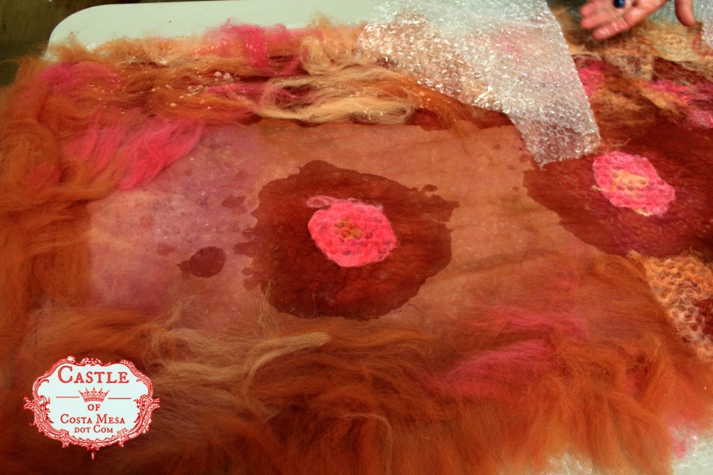 130522 Gisela's nuno-felting scarf project showing flowers sprayed with hot soapy water