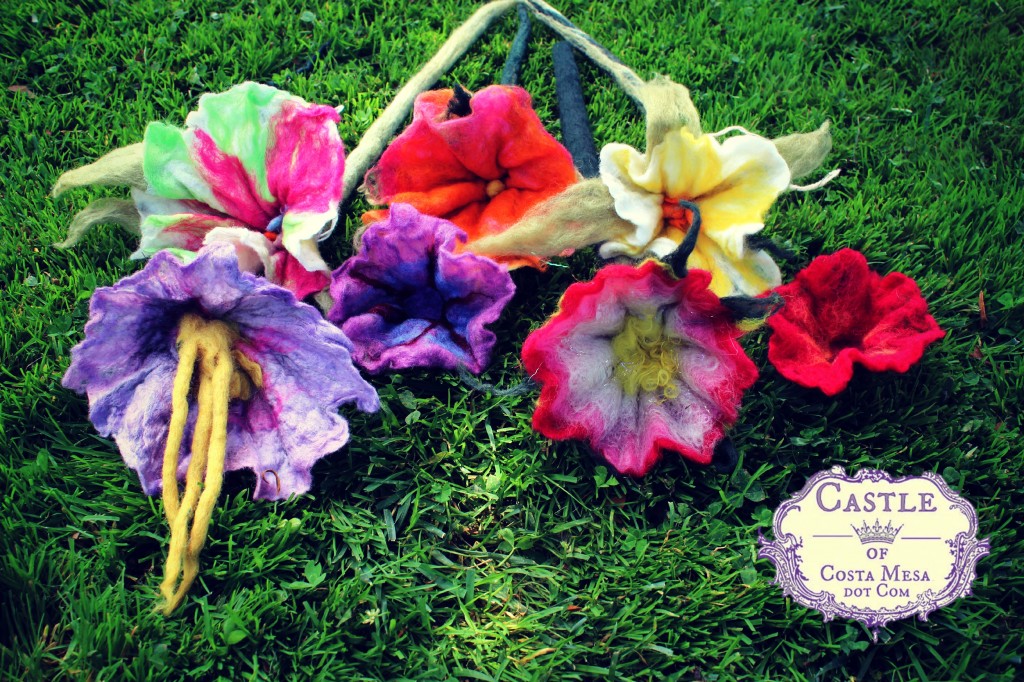 130605 7 completed wet-felted flowers with long stems from this morning's wet-felting work with logo