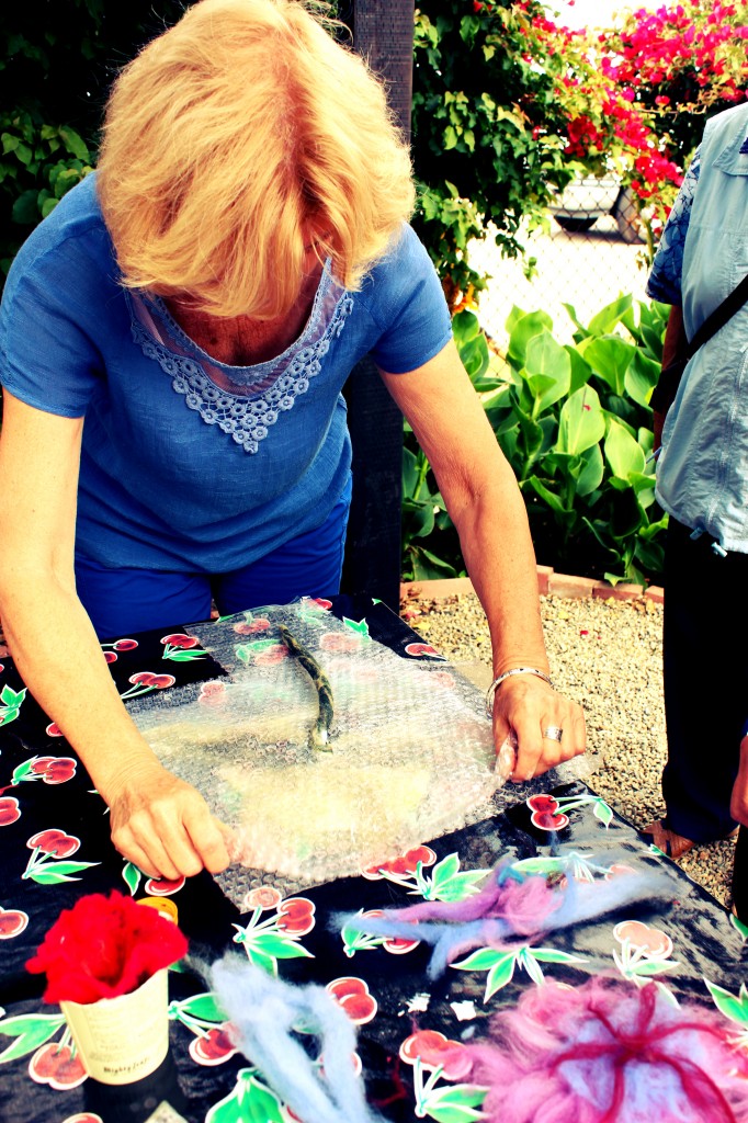 130605 Cut a hole in bubble wrap and cover long stem flower for wet-felting