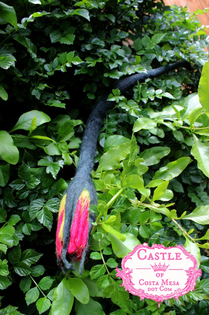 130605 Jzin's newly wet-felted trumpet shaped flower with long stem drying on the honeysuckle bush