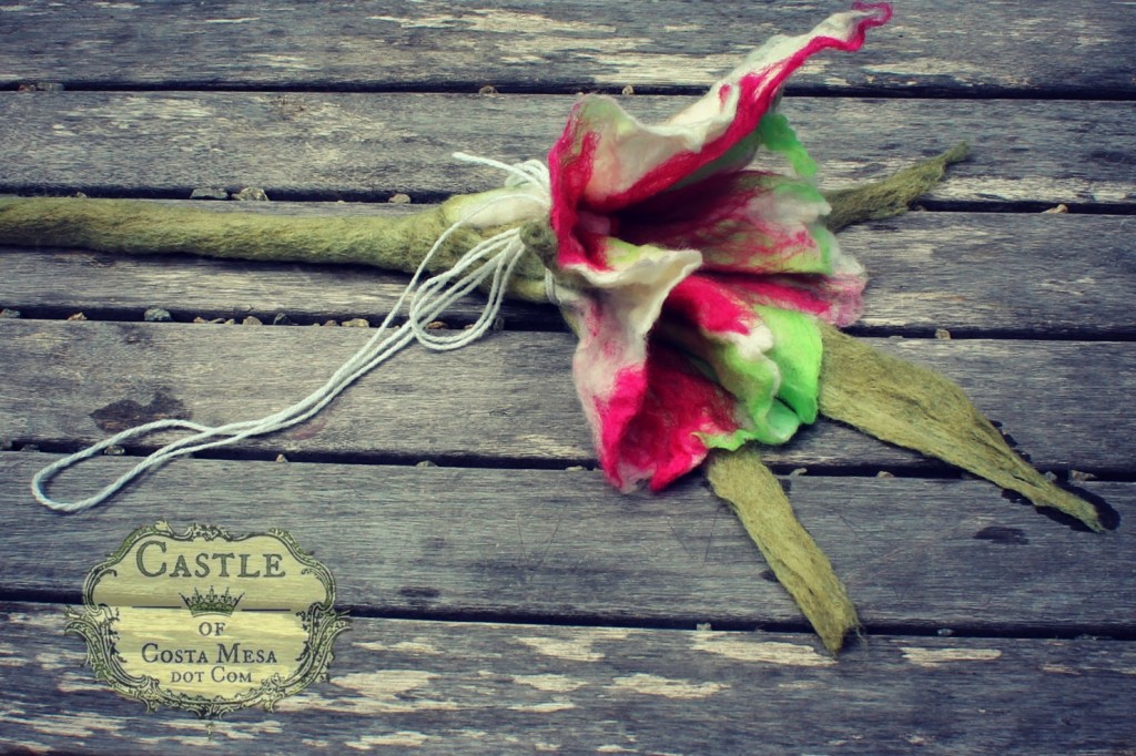 130605 Solana's wet-felted flower with long stem tied up with a string to dry into shape in the sun