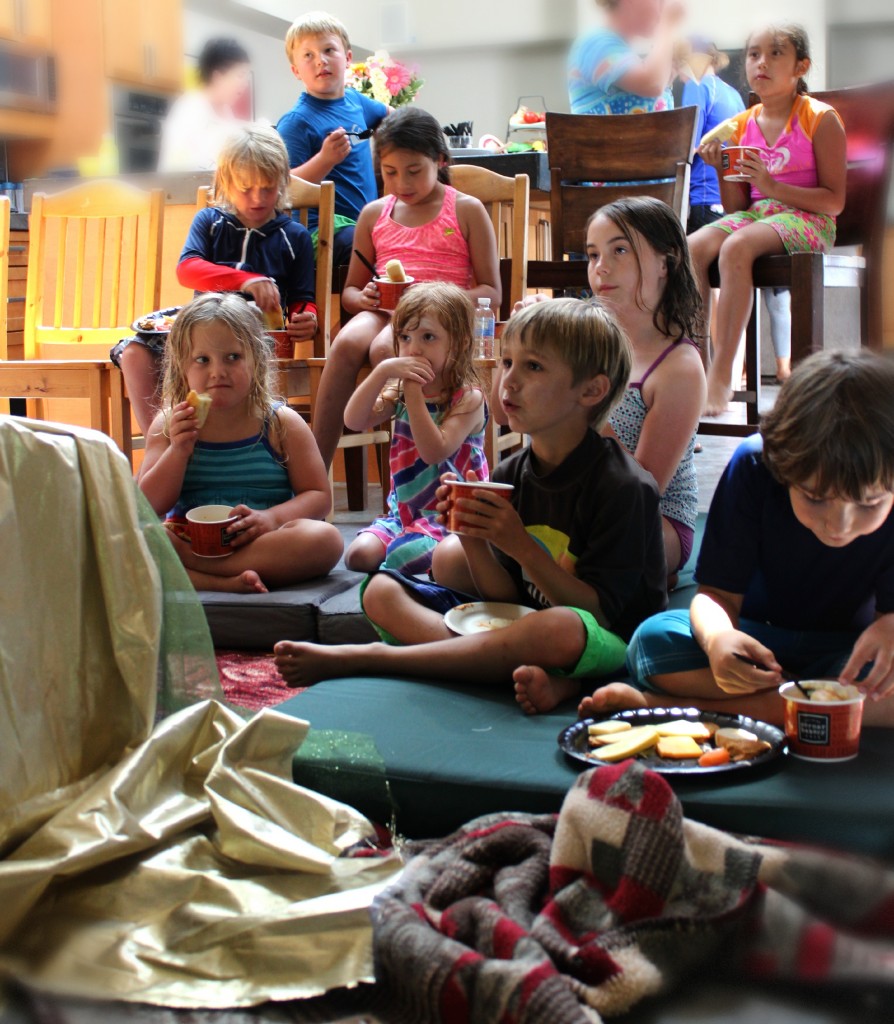 130712 hungry children watching puppet show intently