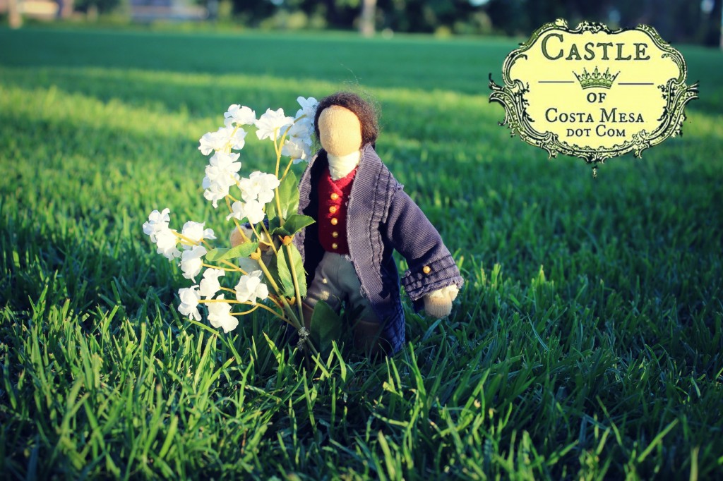 130713 Handsome young man doll with bouquot of white flowers in an open field Balearic