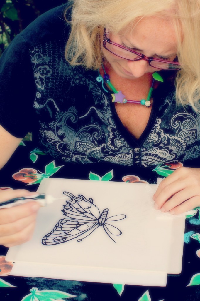 130910 Denise painting a swallowtail butterfly on silk using black Gutta resist