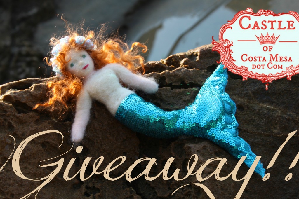 130914 Giveaway. Mermaid Georgina basking on rock