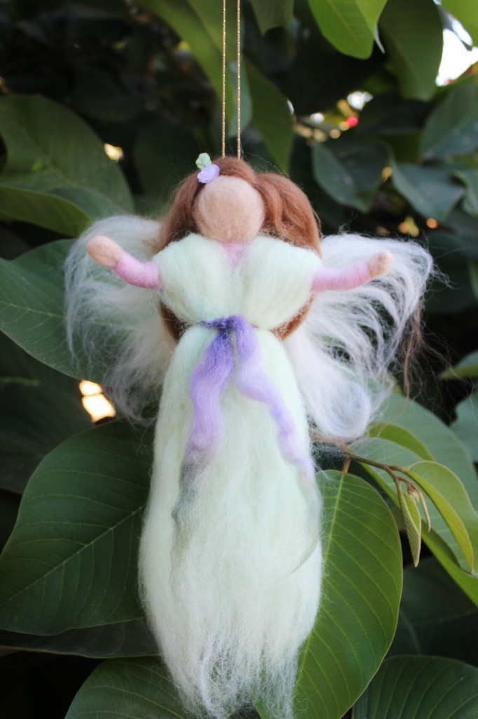 130924 Yasmine's handmade green and lavendar spring pulled roving magic wool fairy angel in cherimoya tree.