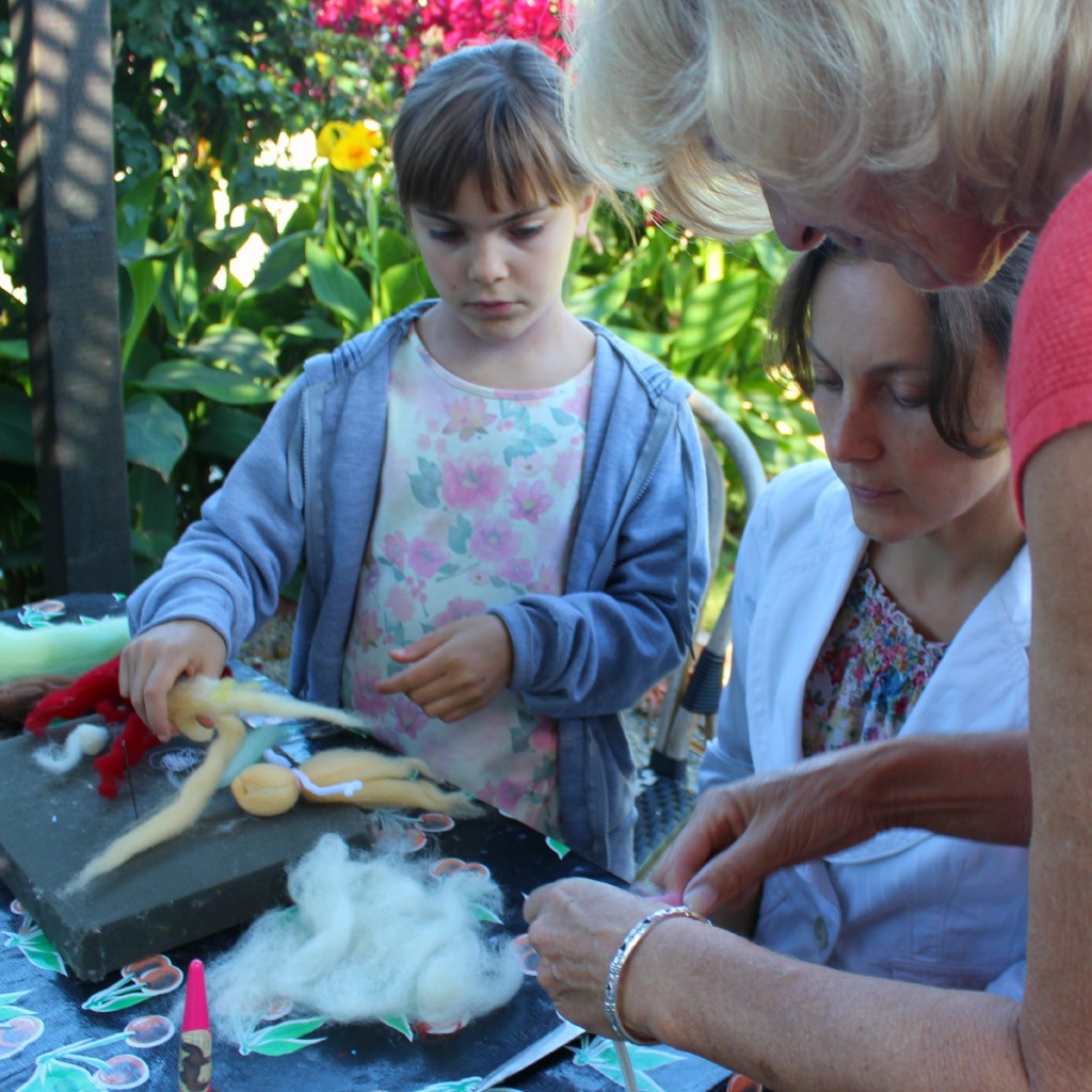 130927 Christine showing Alena and Anicka how to make pulled wool roving angels