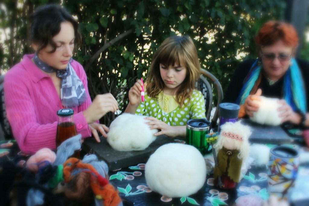 131015 Alena, Anicka, Gisela needle-felting balls of wool batting into pumpkin shapes