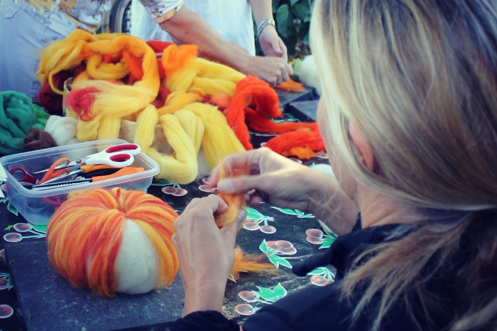 131015 Cathy adding thin strips of wool tops to form variegated textures on needle-felted pumpkin