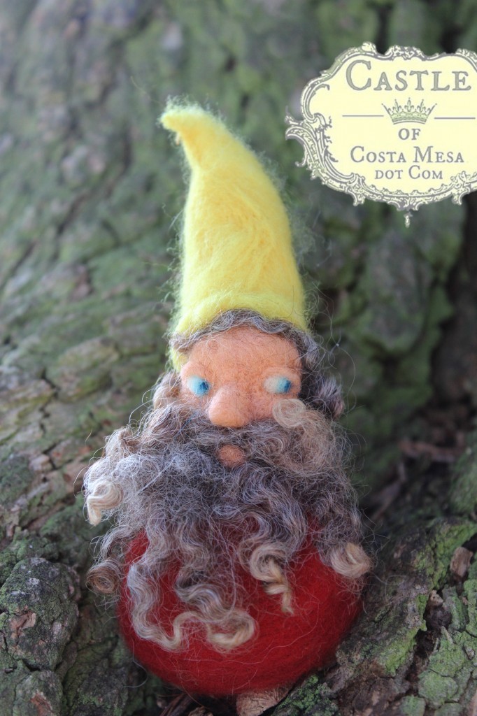 131028 curly bearded yellow capped needle-felted dwarf under a gnarly tree at Vista Park