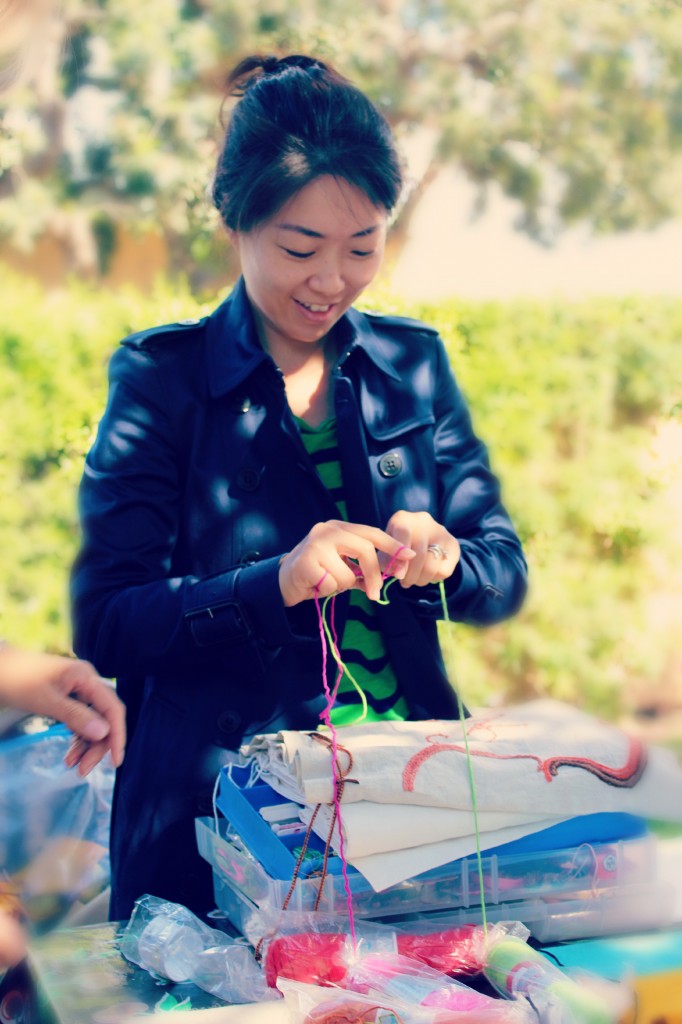 131029 Gloria making cinching string for hand-embroidered bag