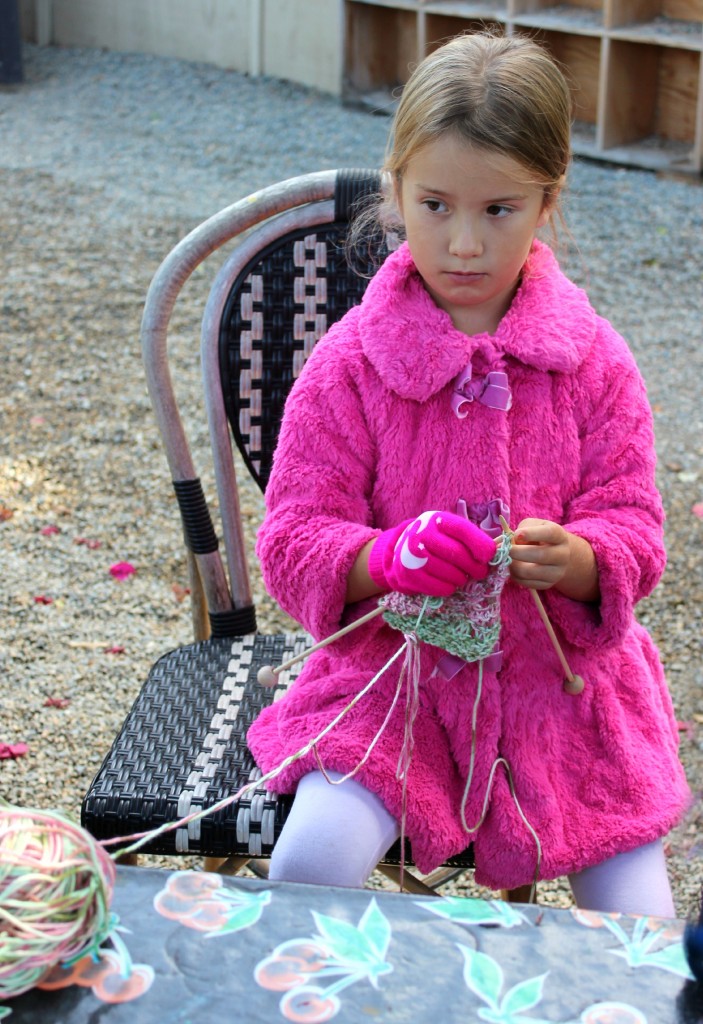 131029 Mia knitting a blanket bag for her handmade baby dolly