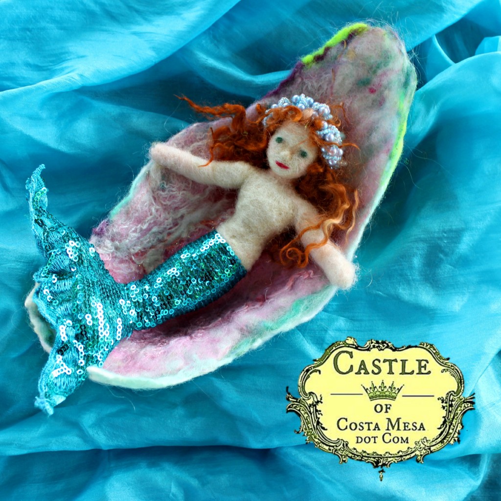 131030 Mermaid Geogiana riding in her wet-felted oyster bed boat vessel on a blue silk sea