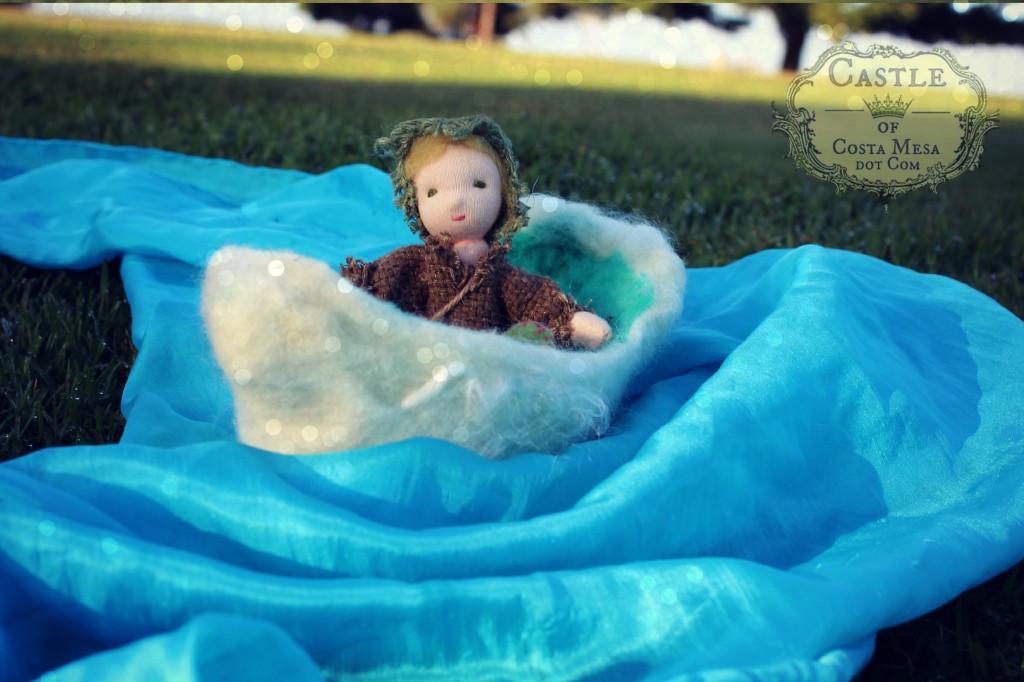 131030 Root child doll rowing in a small white boat around the silk scape river bend 2