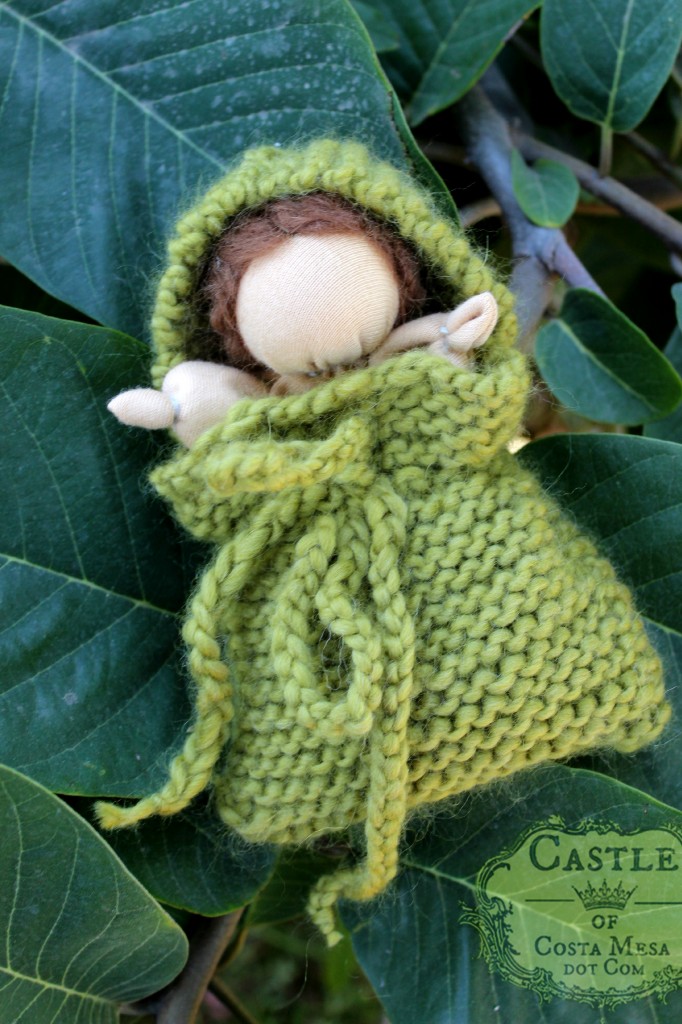 131105 Yvonne's Waldorf style simple baby doll in a green knitted blanket pocket.