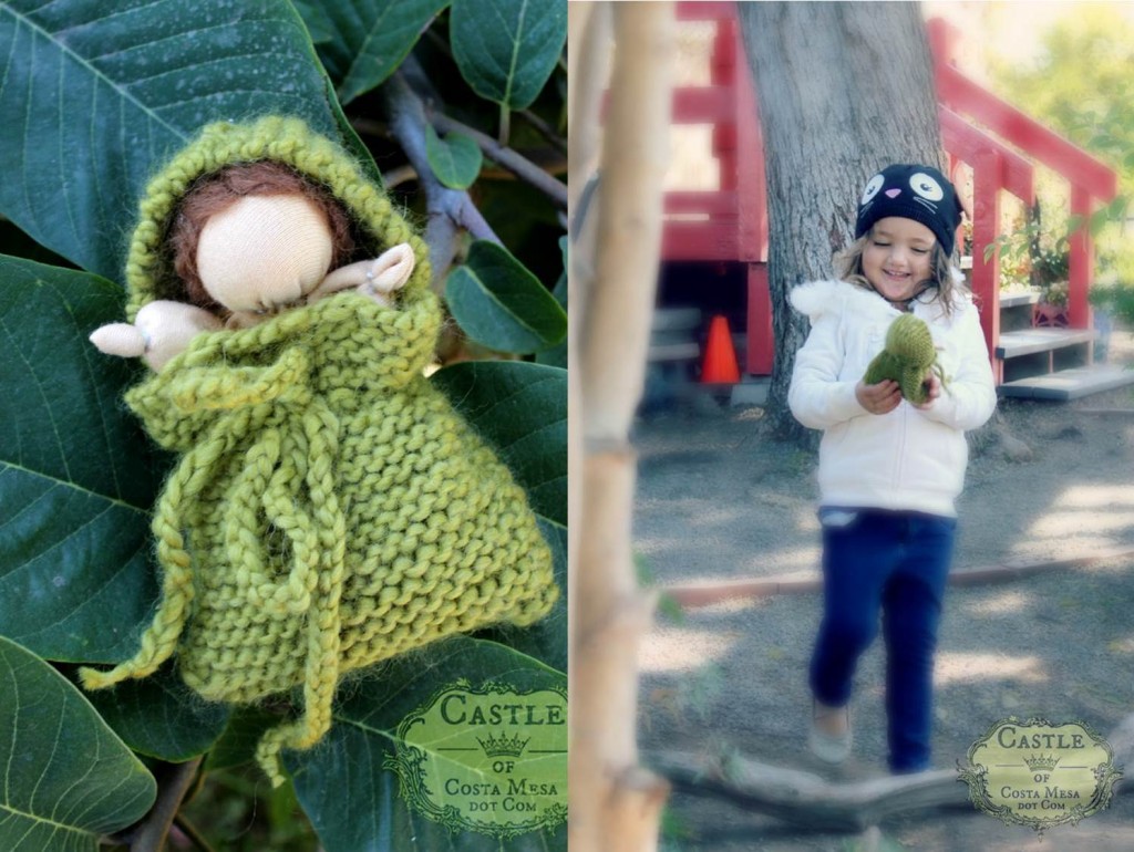 131105 Mommy handmade is always the best. Valentina smiling and playing with her mother's handmade simple Waldorf baby doll in a knitted green blanket.