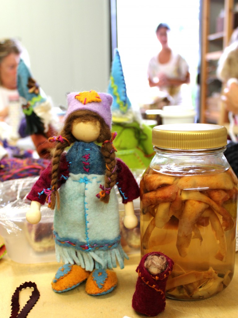 131119 Gisela's bendy doll girl gnome and her gnome baby beside Alena's homemade apple cider at craft group.