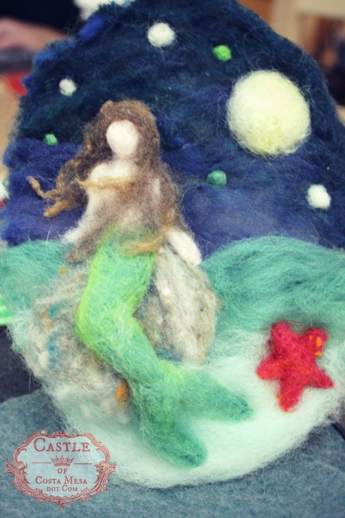 131203 Jzin's wool needle-felted picture of mermaid with green tail on a rock in the moonlight.