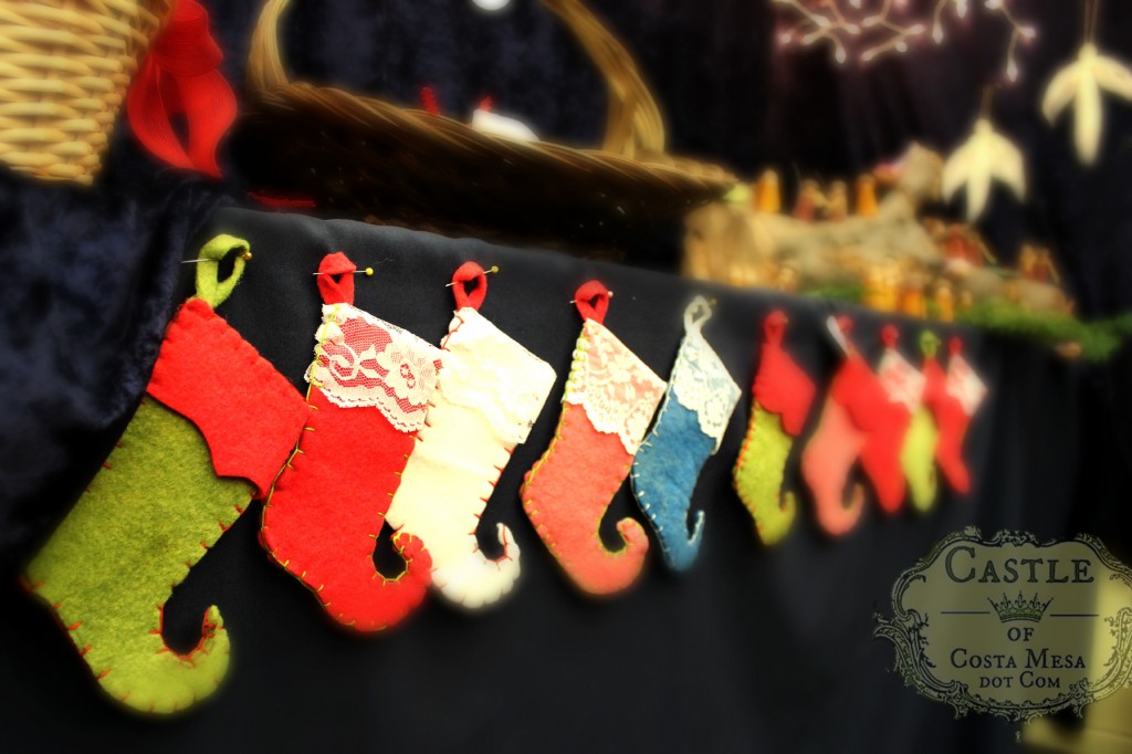 131207 Felt elf's Christmas stockings hanging in a row.