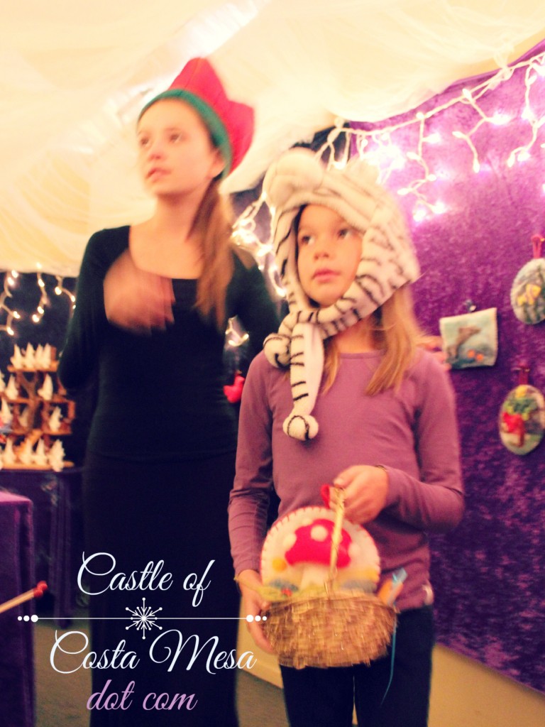 131207 First child entering Elves Workshop picked a fluffy needle-felted toadstool cottage picture for her basket