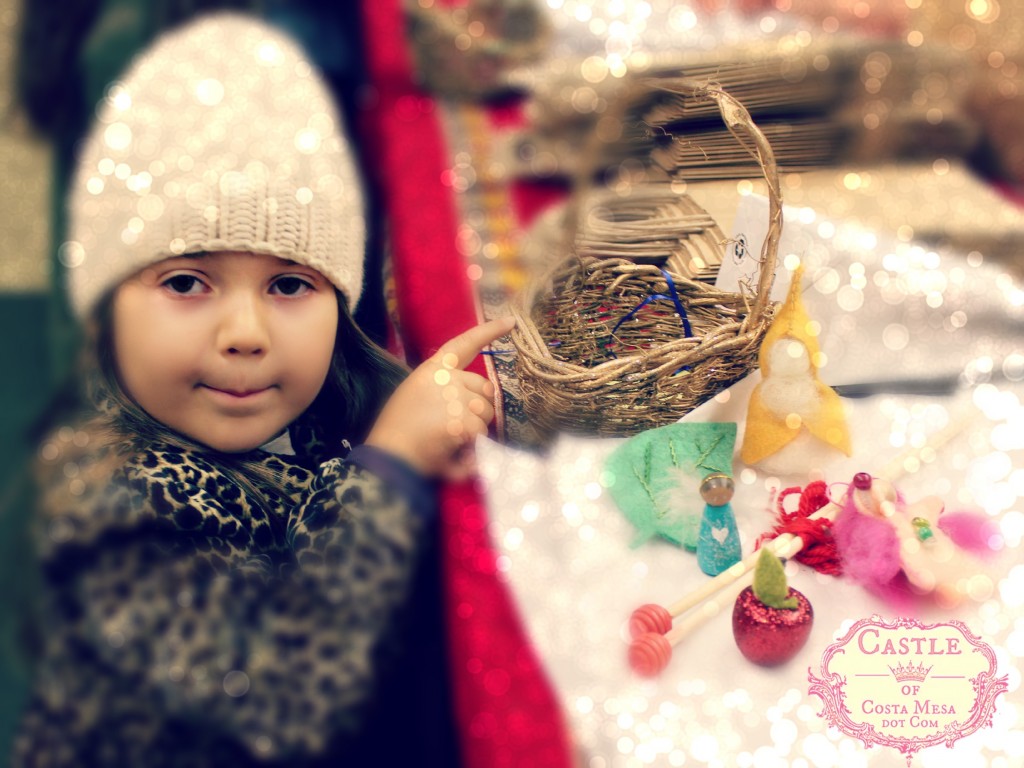 131207 Little girl in white cap showing her basket of treasures from the Elves Workshop