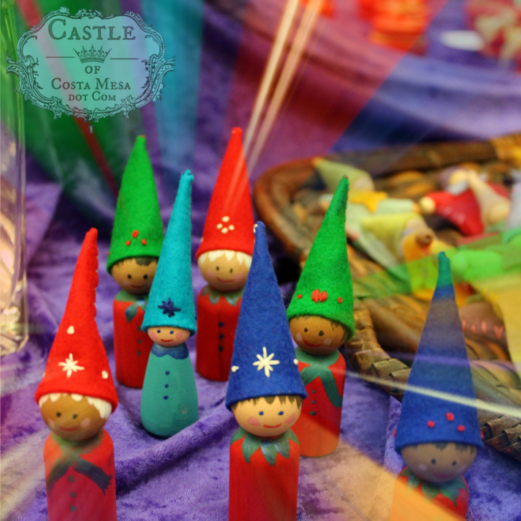 131207 Wooden peg dolls with sweet painted faces and felt pointy caps