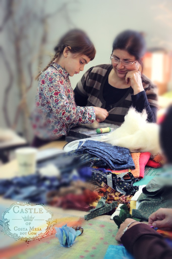 140107 Anicka needle-felting a dog while Aunty Nezehat looks on. With logo