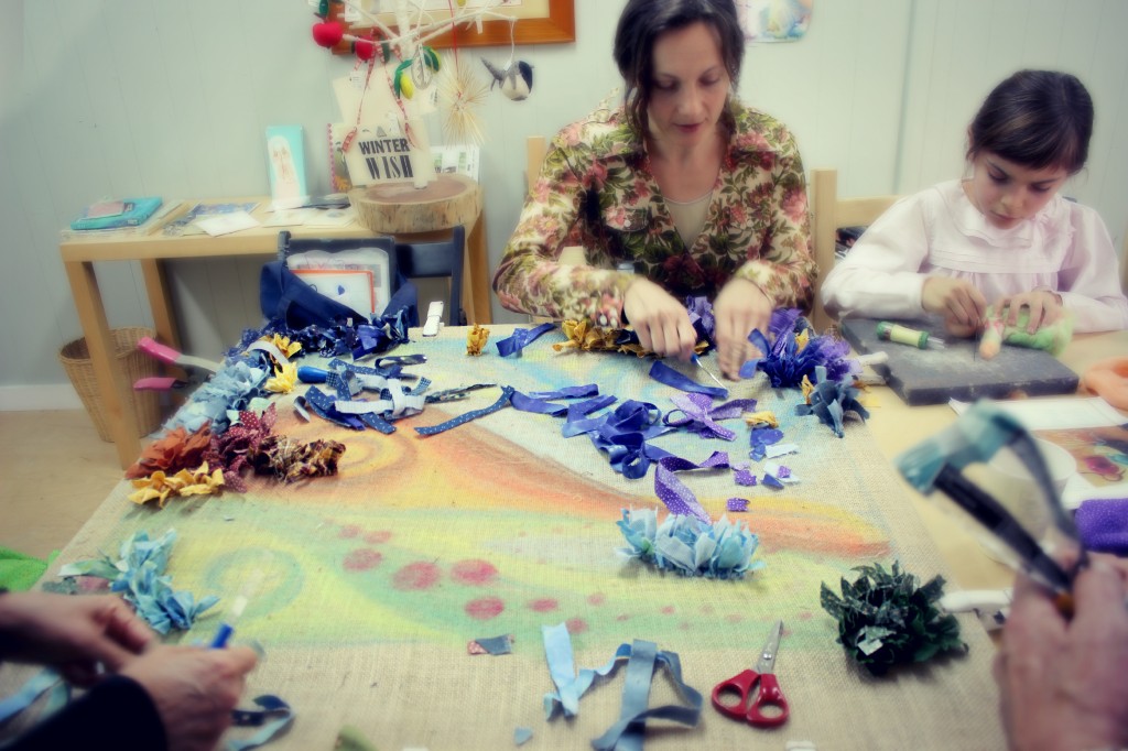 140121 Alena hooking rag rug alongside with Anna needle-felting guardian doll