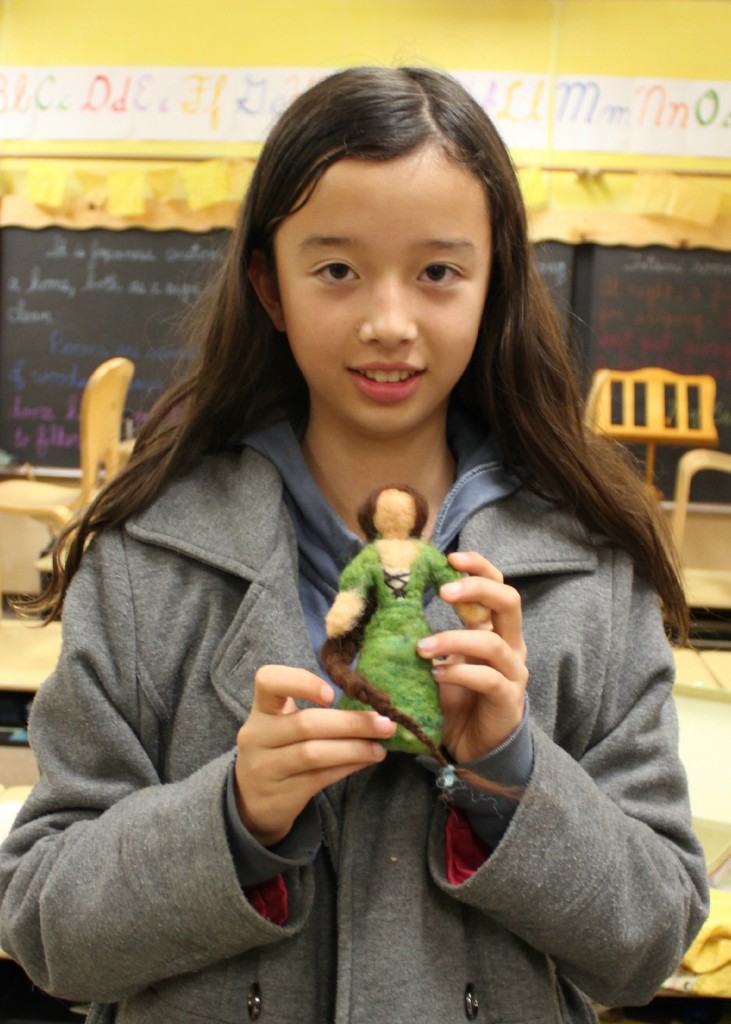 140210 6th Grader Hannah with her newly needle-felted medieval maiden in green with long braid