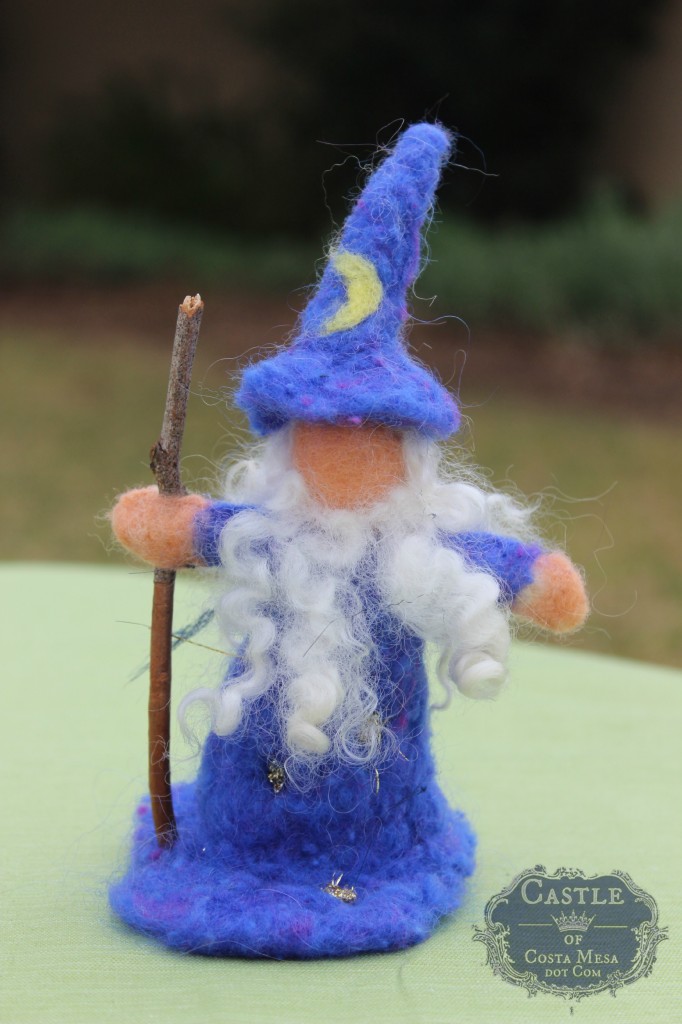 140210 Yvonne's needle-felted Merlin the Wizard with twin staff by flag pole