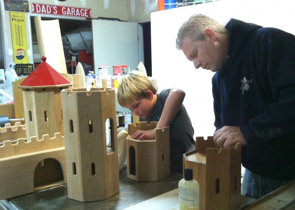 140212 Cole and Jonah Hellar oiling the Schlingl German wooden castle