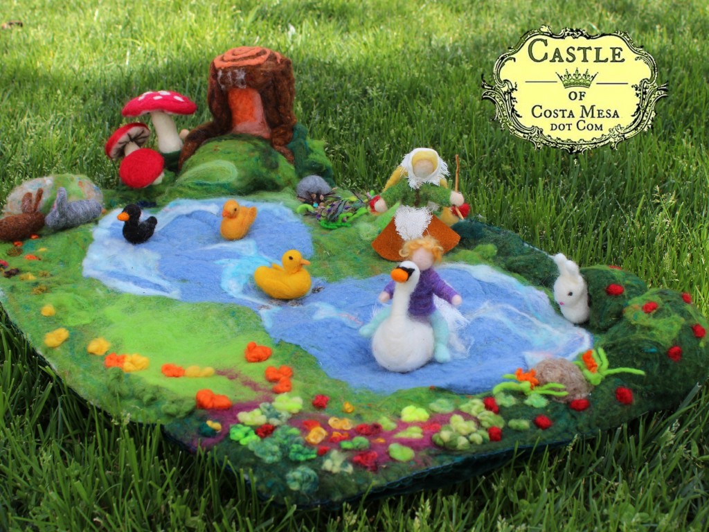 140304 Hansel riding white swan on lilly pond playscape