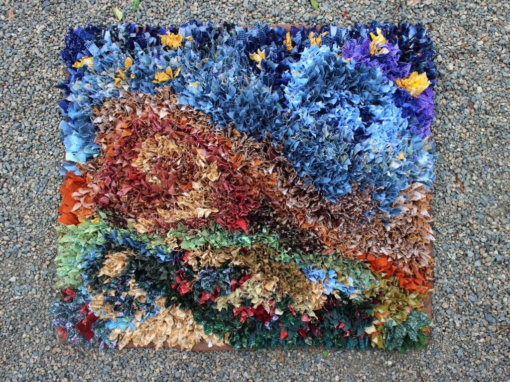 140313 The hooked rag rug is finally completed display on gravel 2 cropped 3x4