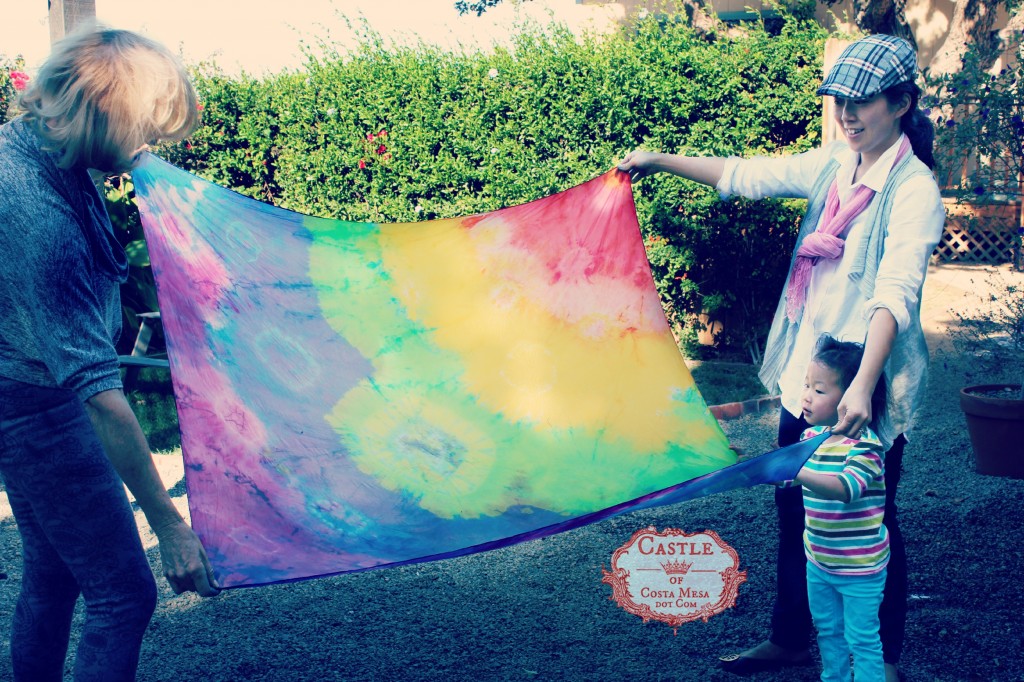 140114 Gloria unfurling her rainbow silk shibori scarf after rinsing