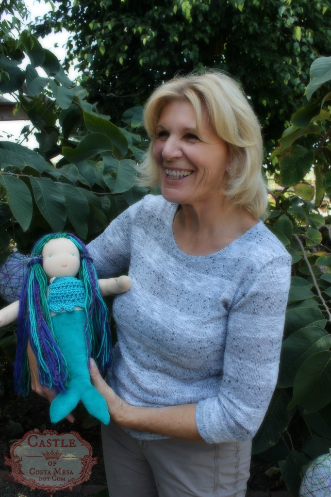 140408 Christine Newell holding her 16 inch waldorf handmade mermaid doll.