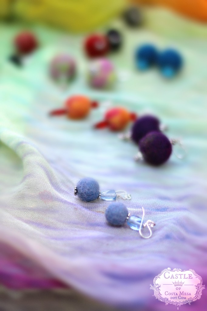 140513 blue wet-felted earrings on Gisela's rainbow scarf 2