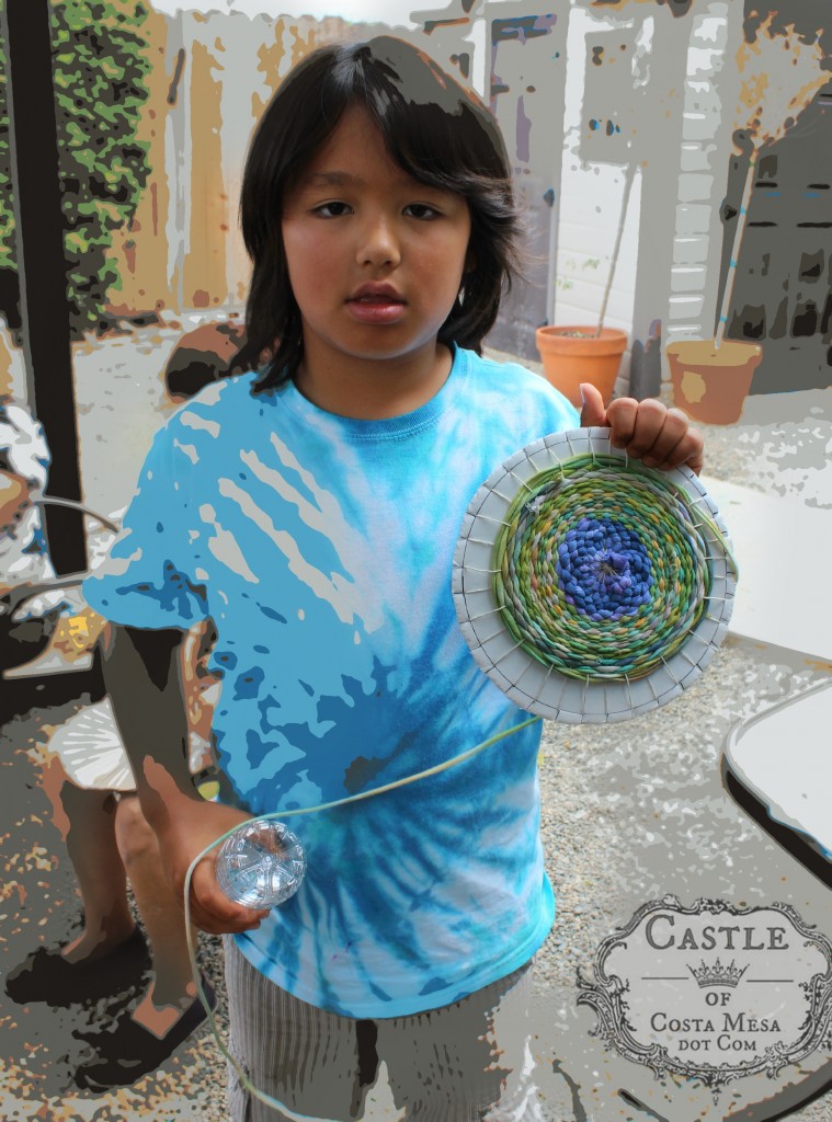 140908 Adrian showing his handmade woven recycled T-shirt placemat posterize  2