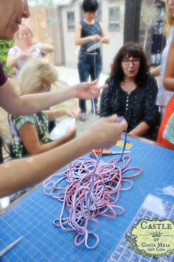 140908 Melissa cuts T-shirt strips into long continuous ball of T-shirt yarn 2