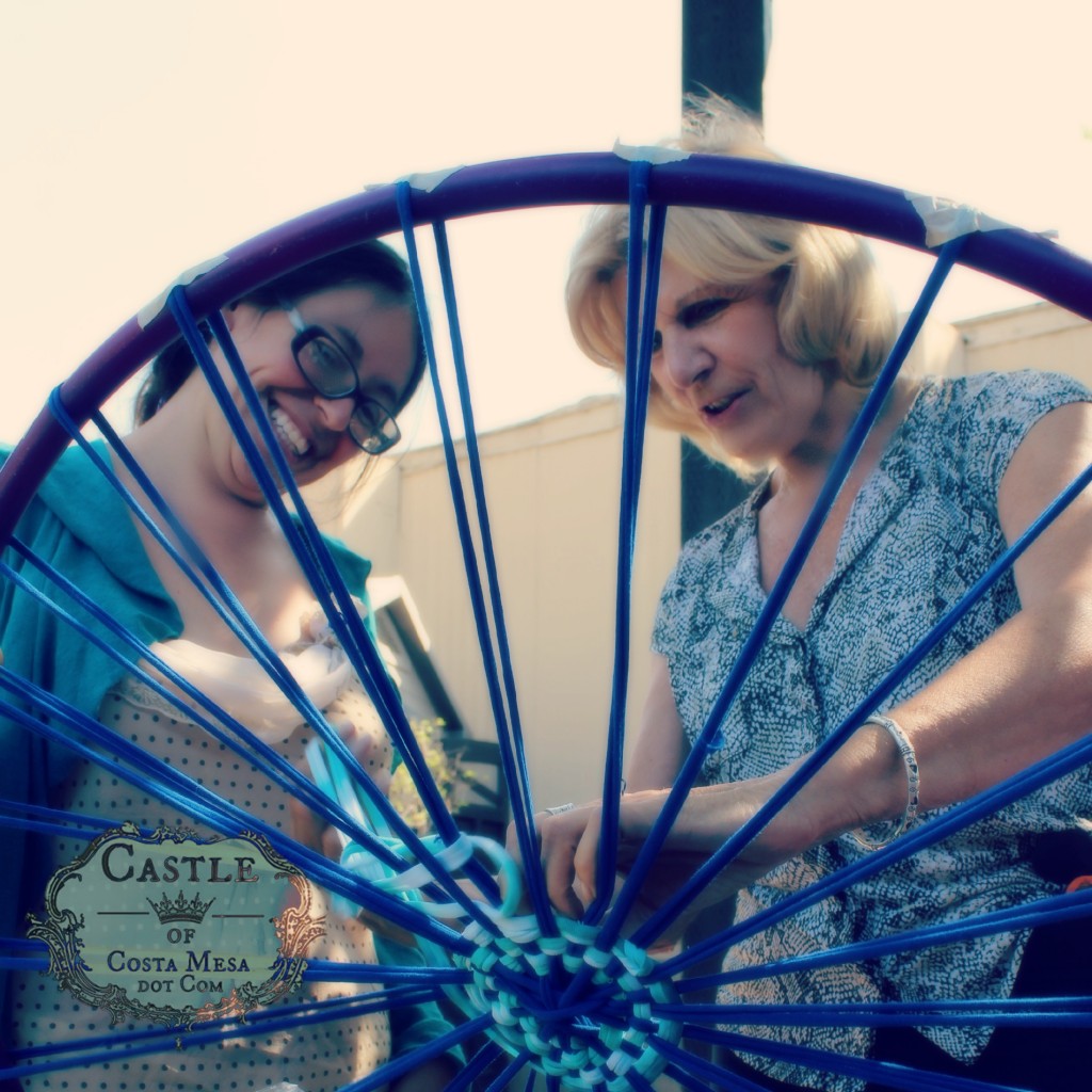 140922 Janet and Christine working on carriage wheel size hula hoop loom for weaving recycled T-shirt yarn bath rug throw 2