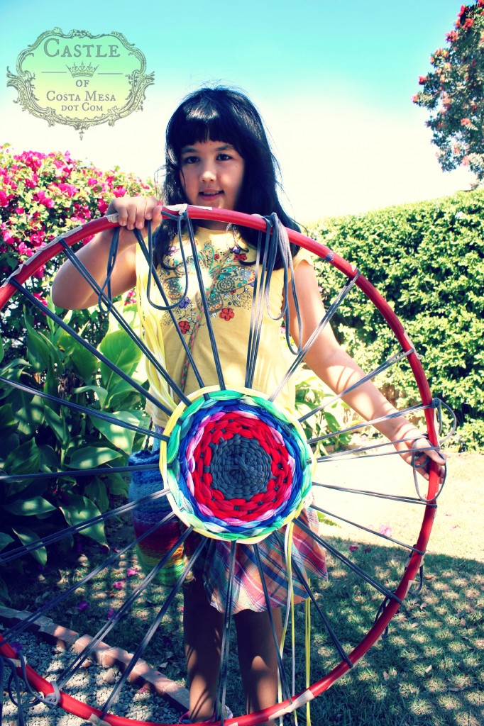 140922 Resplendance of sweet Katya with her weaving on makeshift hula hoop wheel loom 2