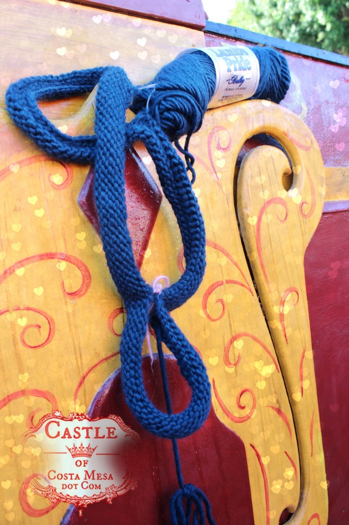 140930 Kathy's knitted bag handle on wooden pirate ship in school yard